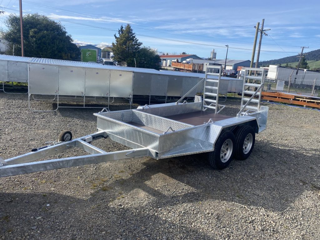 Tandem trailer with ramps and front tool bay